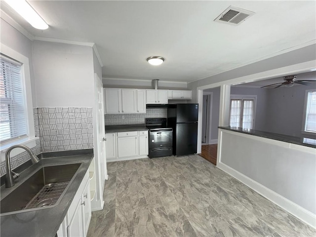 kitchen with tasteful backsplash, sink, white cabinets, and black appliances