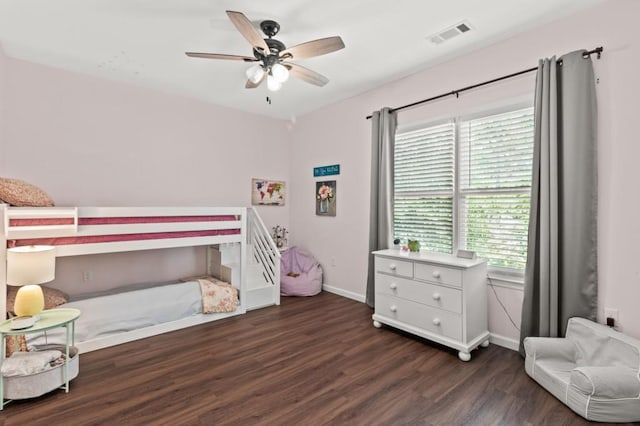 bedroom with dark wood-type flooring and ceiling fan