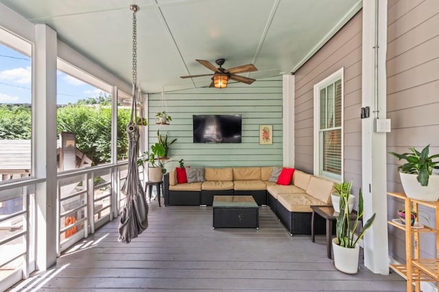 deck featuring outdoor lounge area and ceiling fan