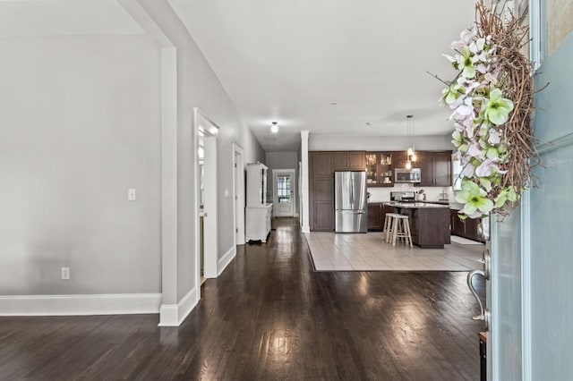 unfurnished living room with hardwood / wood-style floors