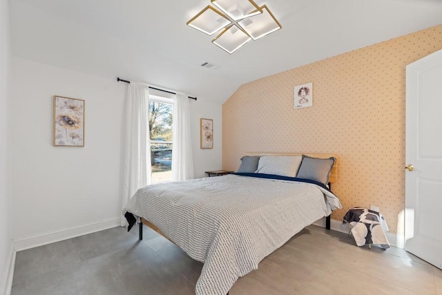 bedroom featuring lofted ceiling