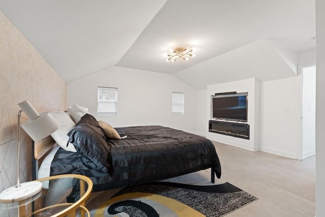 bedroom featuring lofted ceiling