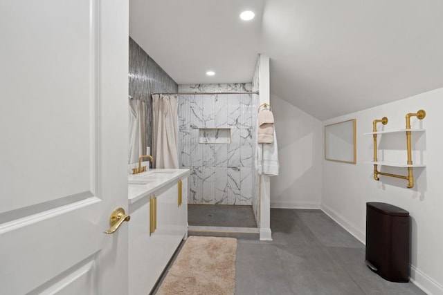 bathroom featuring concrete flooring, a shower with shower curtain, and sink