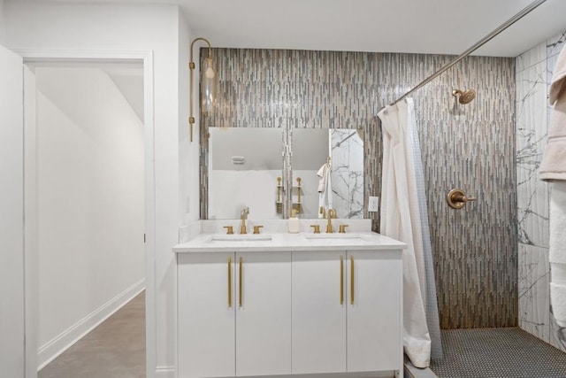 bathroom with curtained shower and vanity