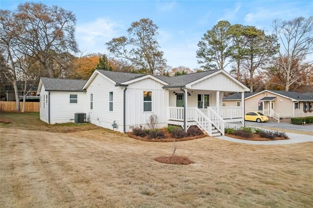 view of front facade with central AC unit and covered porch