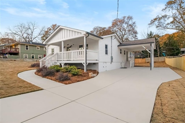 view of front of house with a porch and a carport