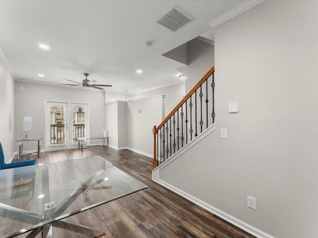 entrance foyer with dark hardwood / wood-style flooring, ceiling fan, french doors, and ornamental molding