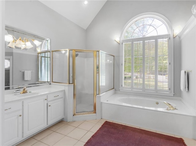 full bath featuring a stall shower, a bath, vanity, lofted ceiling, and tile patterned flooring