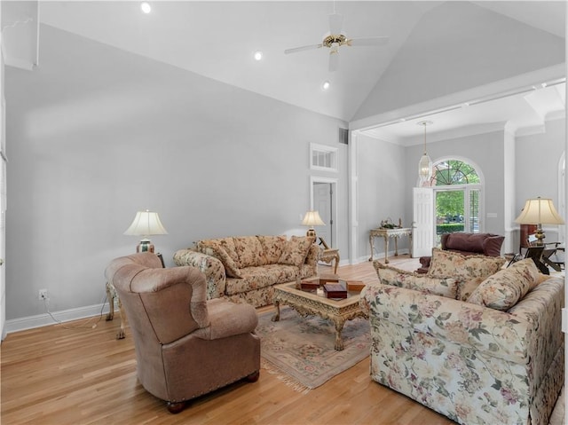 living area featuring high vaulted ceiling, a ceiling fan, light wood finished floors, baseboards, and recessed lighting