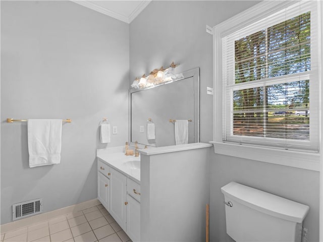 half bathroom with tile patterned flooring, visible vents, toilet, vanity, and crown molding