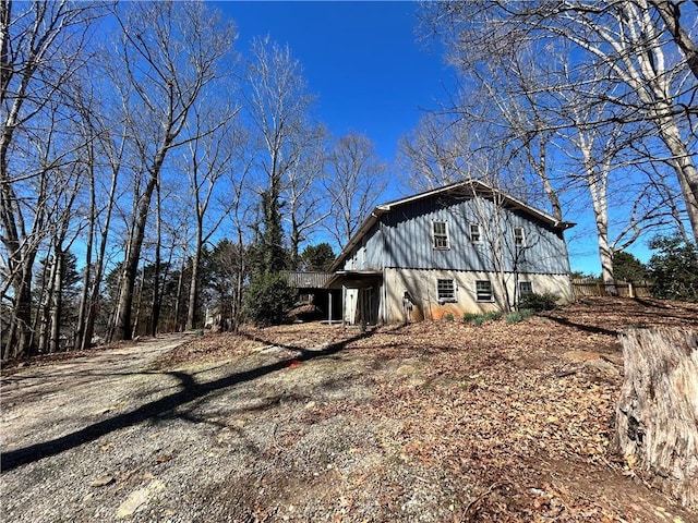 view of home's exterior featuring dirt driveway