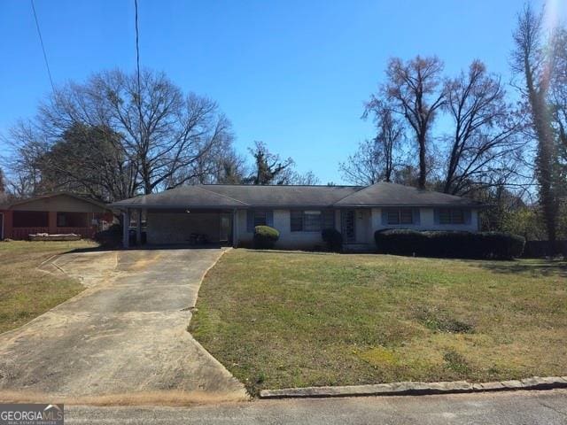 2374 Woodcastle Ln SE, Atlanta, GA 30316 - ranch-style house with a carport, driveway, and a front lawn