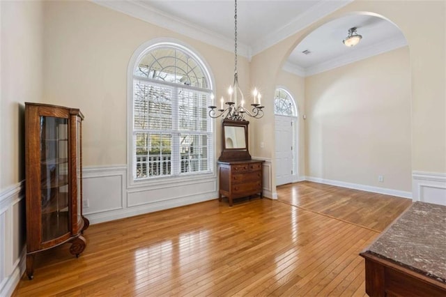 dining room featuring crown molding and light wood-type flooring