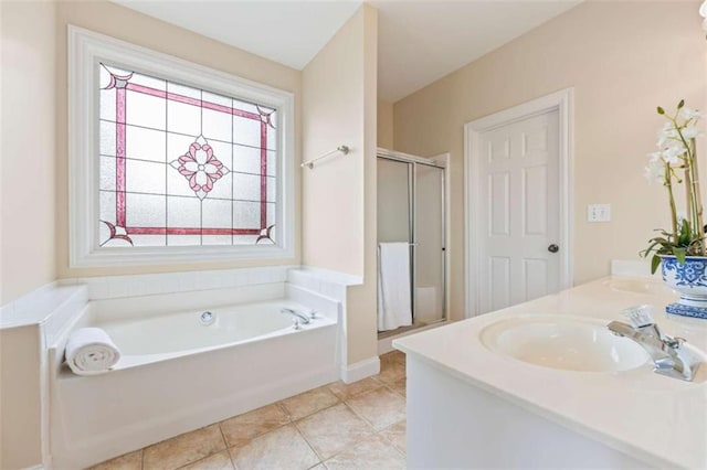 bathroom with tile patterned flooring, vanity, and independent shower and bath