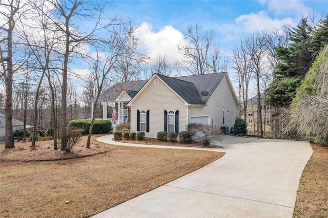 view of front of property with a garage and a front yard