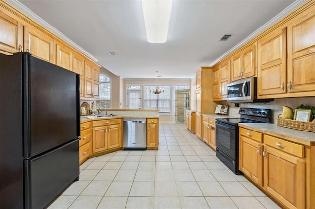 kitchen with light tile patterned floors, hanging light fixtures, backsplash, black appliances, and kitchen peninsula