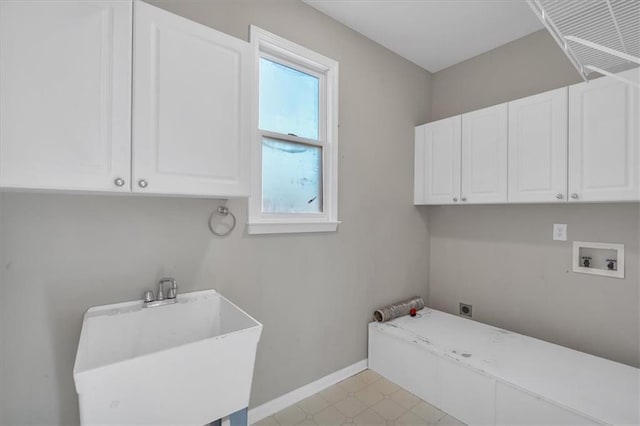 clothes washing area featuring cabinets, washer hookup, sink, and electric dryer hookup