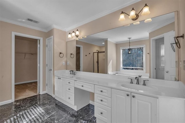 bathroom with ornamental molding, a shower with shower door, and vanity