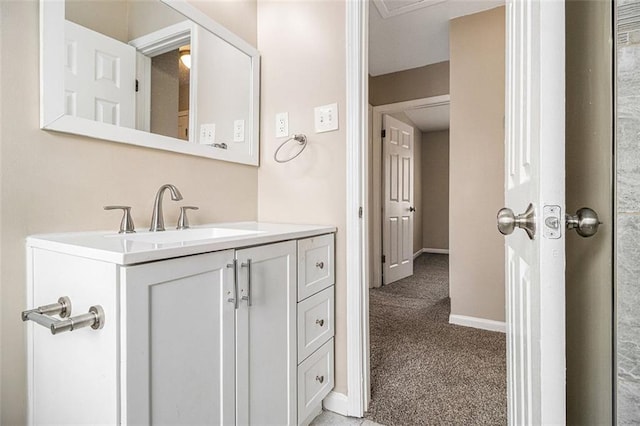 bathroom with vanity and baseboards