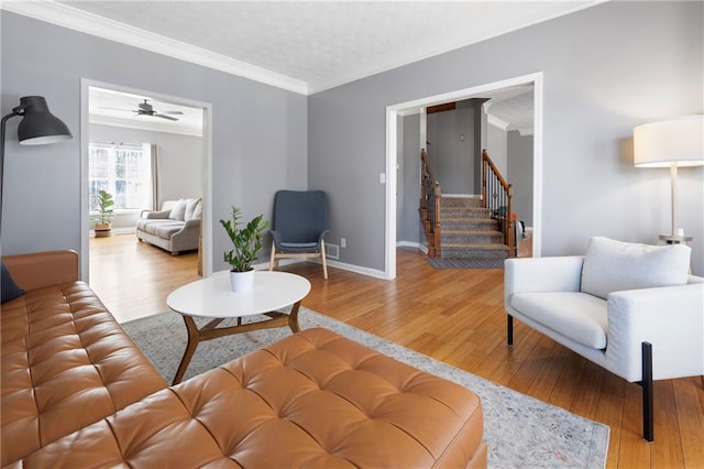 living room featuring crown molding and hardwood / wood-style floors