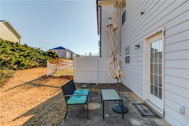 view of patio featuring fence