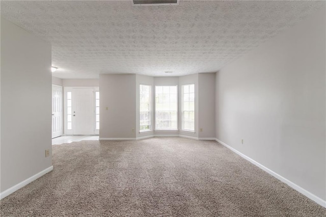 2191 Phillips Rd, Lithonia, GA 30058 - carpeted empty room featuring plenty of natural light and baseboards
