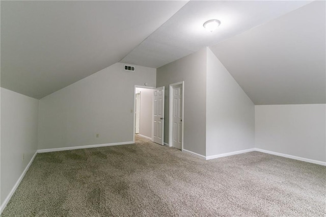 2191 Phillips Rd, Lithonia, GA 30058 - additional living space with carpet, lofted ceiling, and baseboards