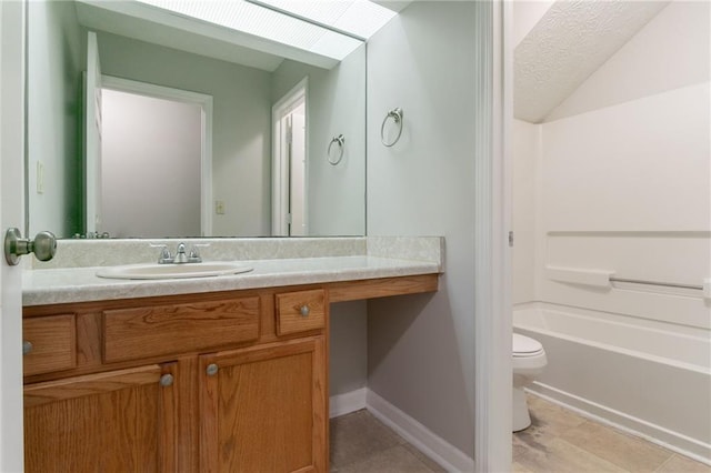 2191 Phillips Rd, Lithonia, GA 30058 - full bathroom featuring toilet, vanity, tile patterned floors,  shower combination, and vaulted ceiling
