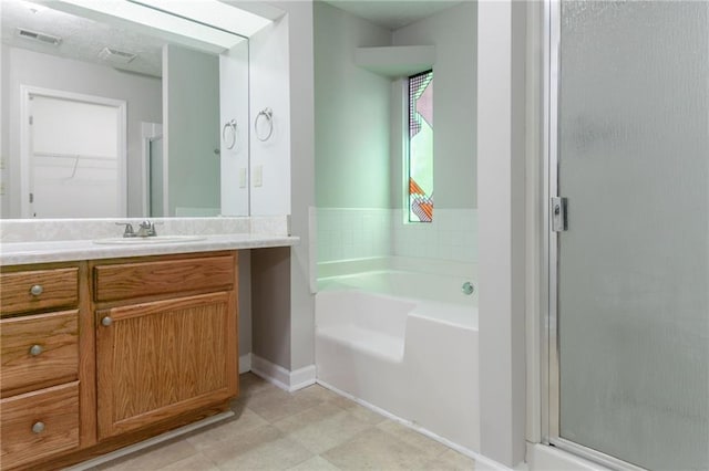 2191 Phillips Rd, Lithonia, GA 30058 - full bath with vanity, a garden tub, a shower stall, baseboards, and a walk in closet