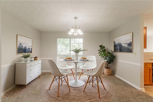 2191 Phillips Rd, Lithonia, GA 30058 - dining space featuring a chandelier, baseboards, and light colored carpet