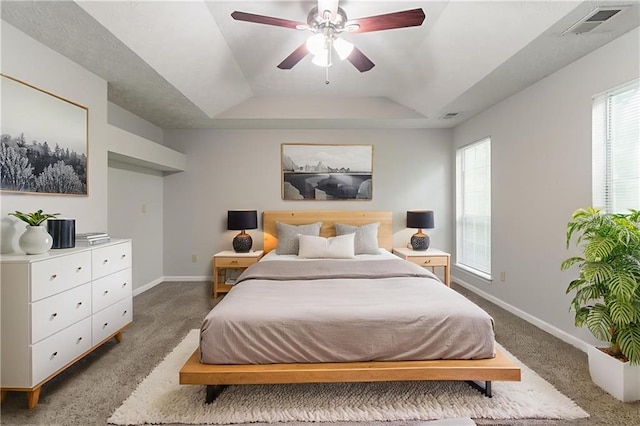 2191 Phillips Rd, Lithonia, GA 30058 - carpeted bedroom with a raised ceiling, baseboards, and a ceiling fan
