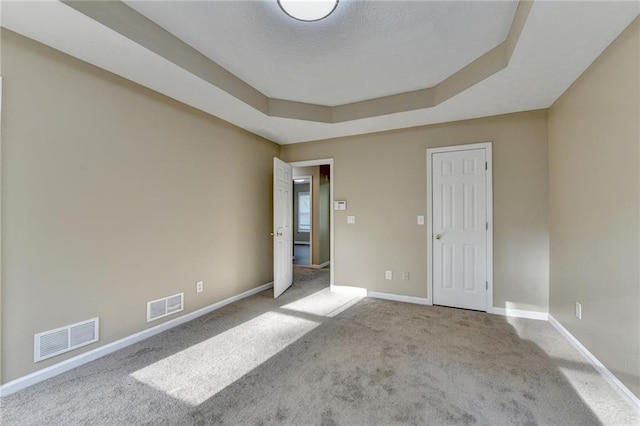 1400 Scenic Brook Trl SW, Conyers, GA 30094 - carpeted spare room featuring a tray ceiling and baseboards