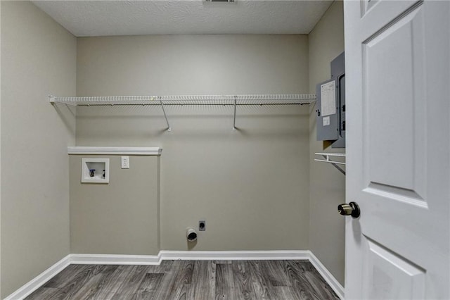 1400 Scenic Brook Trl SW, Conyers, GA 30094 - clothes washing area featuring washer hookup, wood finished floors, electric dryer hookup, and baseboards