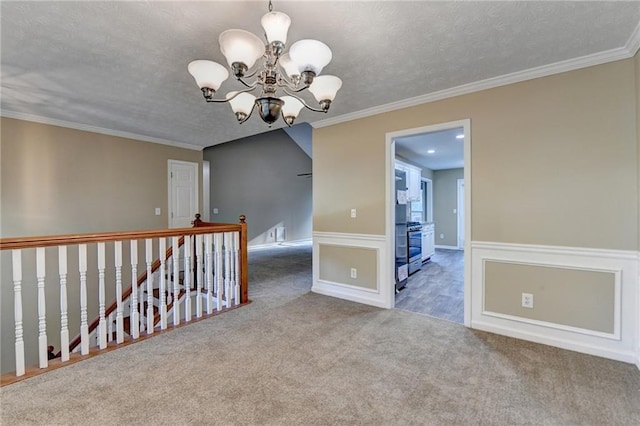 1400 Scenic Brook Trl SW, Conyers, GA 30094 - carpeted spare room featuring a chandelier, a textured ceiling, crown molding, and wainscoting