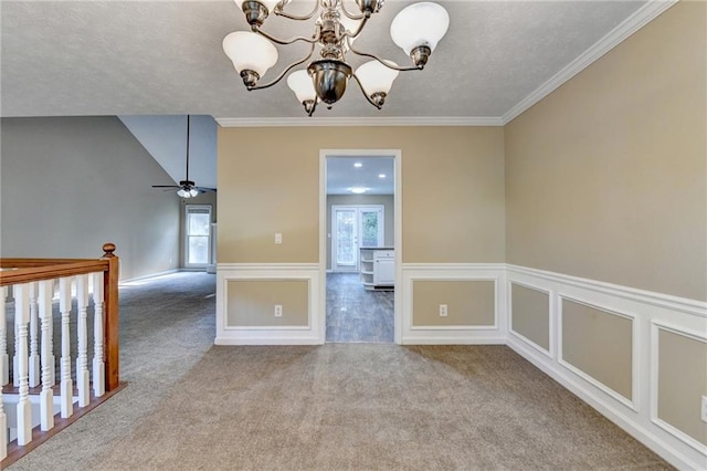 1400 Scenic Brook Trl SW, Conyers, GA 30094 - carpeted empty room featuring healthy amount of natural light, a chandelier, a textured ceiling, crown molding, and wainscoting