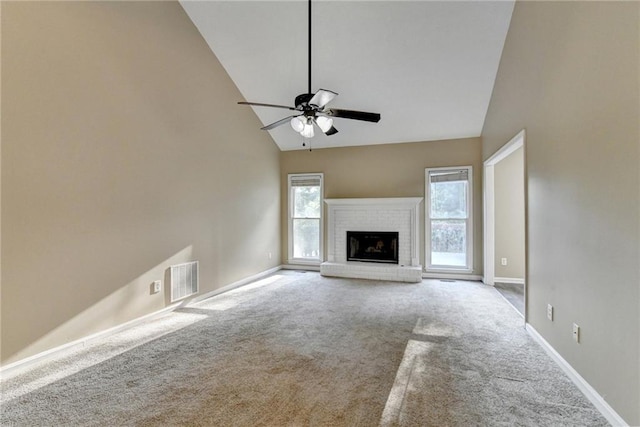 1400 Scenic Brook Trl SW, Conyers, GA 30094 - unfurnished living room with healthy amount of natural light, carpet, high vaulted ceiling, ceiling fan, and baseboards