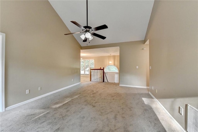 1400 Scenic Brook Trl SW, Conyers, GA 30094 - unfurnished living room with carpet floors, high vaulted ceiling, ceiling fan, baseboards, and a chandelier