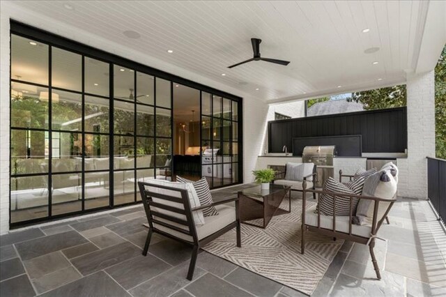 view of patio with an outdoor hangout area and ceiling fan