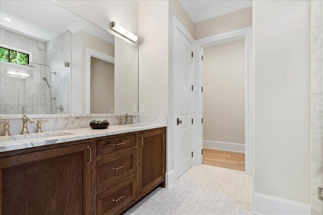 bathroom featuring walk in shower, vanity, and wood-type flooring