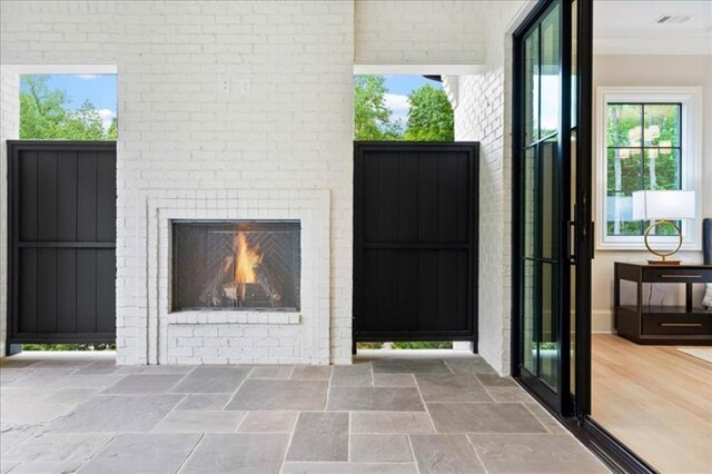 interior space featuring an outdoor brick fireplace