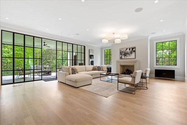 living room featuring a wealth of natural light and light hardwood / wood-style floors