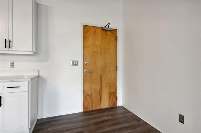 laundry room with dark hardwood / wood-style flooring