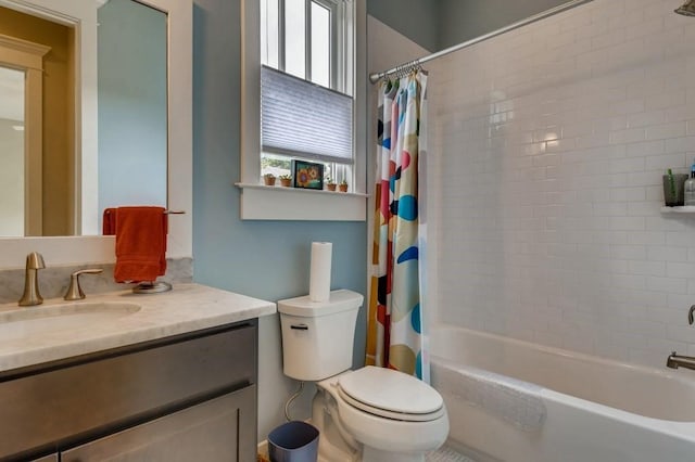 full bathroom with vanity, shower / tub combo with curtain, and toilet