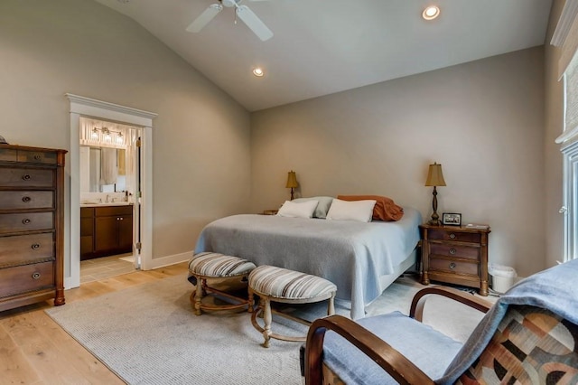 bedroom featuring connected bathroom, light tile flooring, vaulted ceiling, ceiling fan, and sink