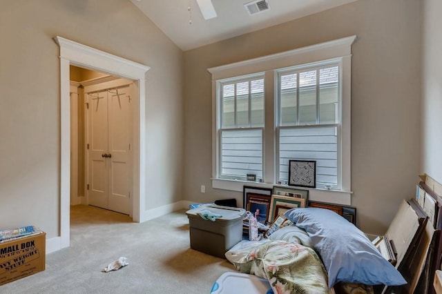 miscellaneous room with ceiling fan, light carpet, and vaulted ceiling