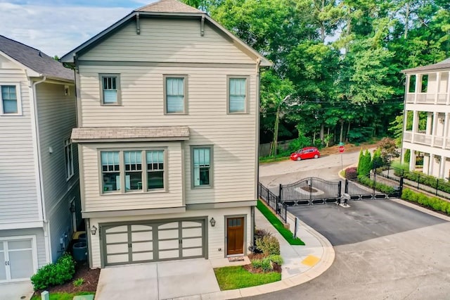 view of front of property featuring central AC and a garage