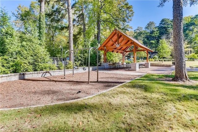 view of property's community featuring a lawn, a gazebo, and a playground