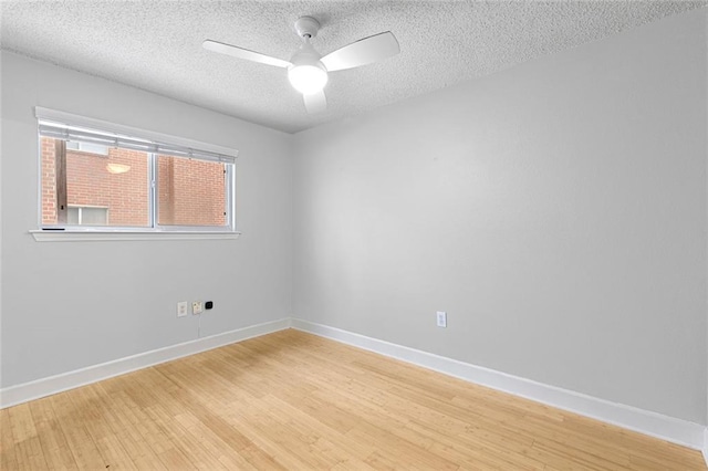 387 Ralph Mcgill Blvd NE Unit K, Atlanta, GA 30312 - unfurnished room featuring light wood-type flooring, a textured ceiling, ceiling fan, and baseboards