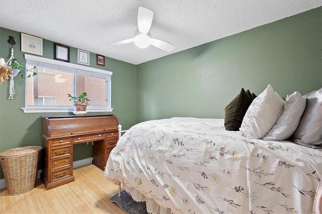387 Ralph Mcgill Blvd NE Unit K, Atlanta, GA 30312 - bedroom featuring light wood finished floors, a textured ceiling, and ceiling fan
