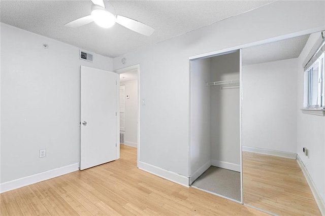387 Ralph Mcgill Blvd NE Unit K, Atlanta, GA 30312 - unfurnished bedroom featuring light wood finished floors, a closet, a textured ceiling, baseboards, and ceiling fan